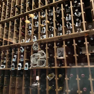  wine rack full of wine bottles