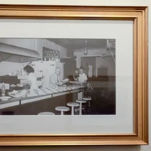  black and white photograph of a kitchen