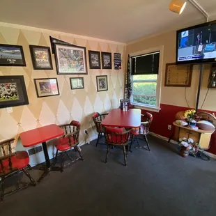 a dining room with a television and a bar