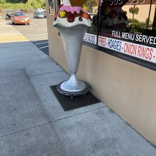 an ice cream sundae outside of a restaurant