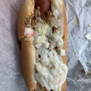 a hot dog with coleslaw