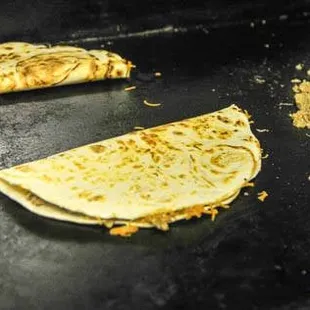 a tortilla being prepared