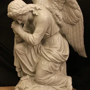 We also restore monuments, statues and funerary sculpture.  This zinc angel was cleaned, patched, welded and powder-coated.