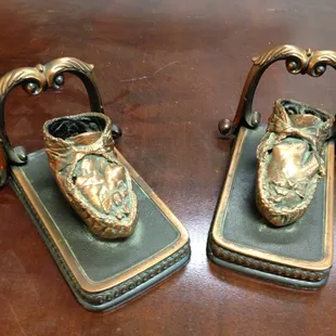 A pair of bronzed baby booties that we brazed back together.