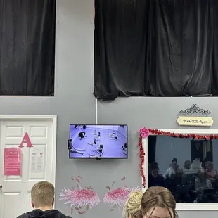 You can watch your kid on a tv screen in dance class