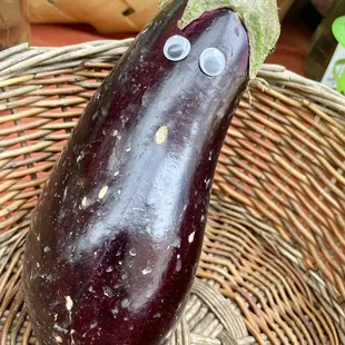 n eggplant with googly eyes