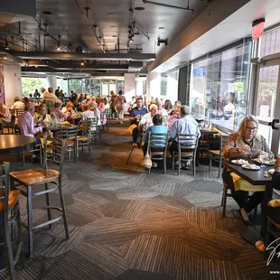 a large group of people sitting at tables
