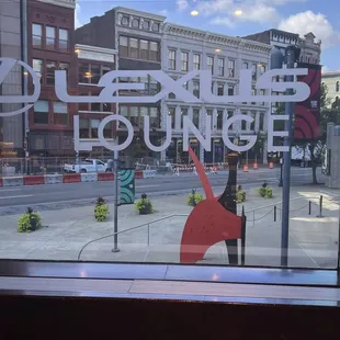 a woman standing in front of a window