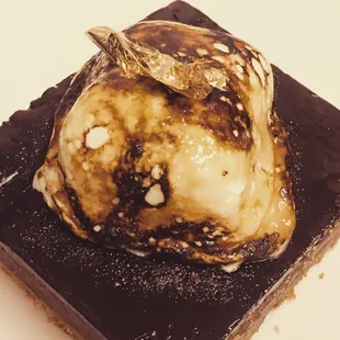 S'mores : Graham Crust, Chocolate Ganache, House Made Marshmallow Brûlée, and Gold Leaf