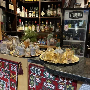 a bar with a variety of dishes on the counter