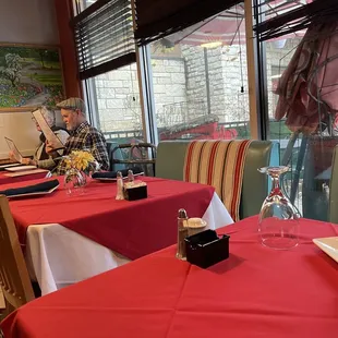 a woman sitting at a restaurant table