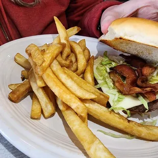 a burger and fries on a plate