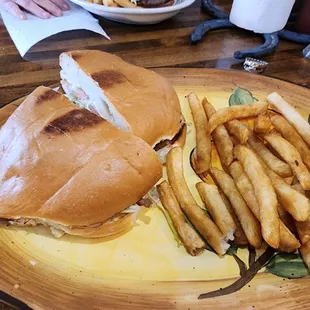 a sandwich and fries on a plate