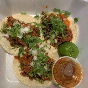 Chorizo tacos  cilantro and onions side of homemade red hot sauce $10