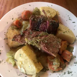 a plate of meat and vegetables
