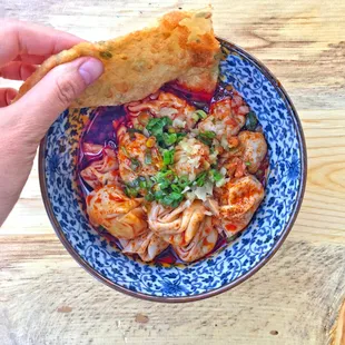 Scallion Pancake dipped in Spicy Wontons