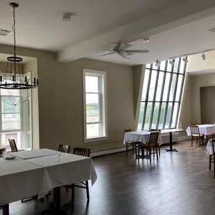 ables and chairs in a large room