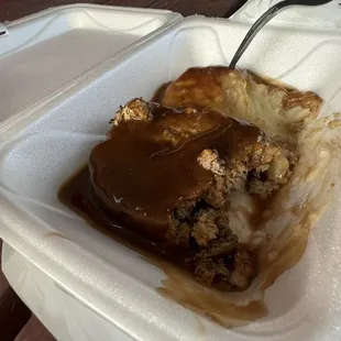 a piece of dessert in a styrofoam container