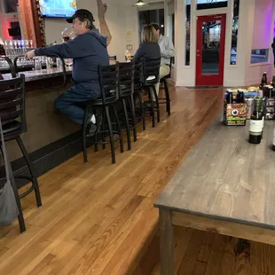 people sitting at a bar