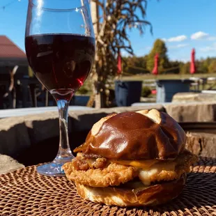a burger and a glass of wine