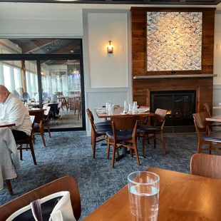 Dining room looking towards the bar. Lots of bay front windows.
