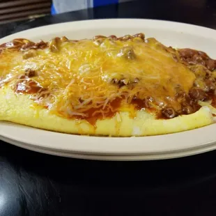 chili cheese omelet. 3 eggs, heaping order of home made chili, smothered in shredded cheese. 
served with toast or biscuit n  gravy
$5.50