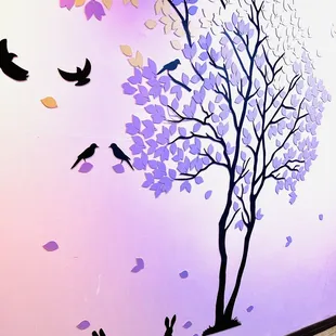 Cute wall art in front of the restrooms