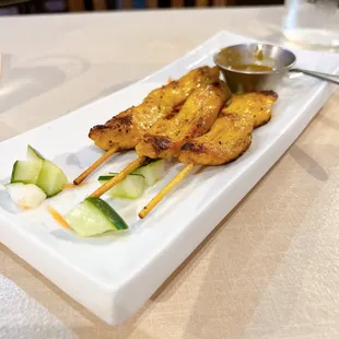 We had already eaten two skewers - Chicken Satay