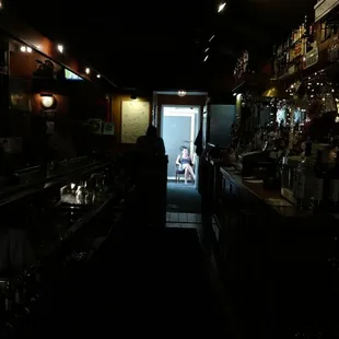 a dimly lit bar area