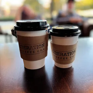 two coffee cups on a table