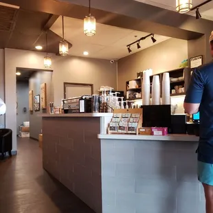 a man standing in front of a counter