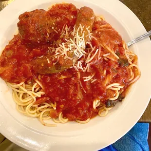 Spaghetti w/tomato sauce, plus one meatball and one sausage!