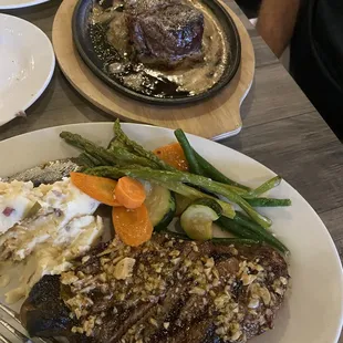 a plate of steak and vegetables