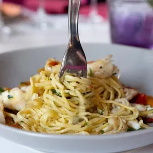 a bowl of pasta with a fork