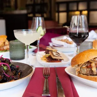 plates of food and glasses of wine