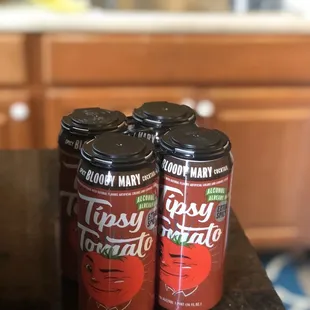 three cans on a countertop