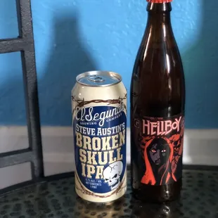 a bottle and a can on a table