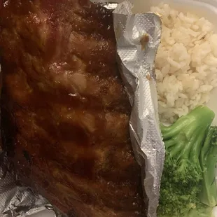 Half rack of ribs with white rice and broccoli