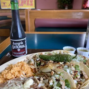 Chicken taco plate was delicious! Comes with 3 your choice of meat, rice and beans.