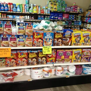 a variety of cereals on display in a grocery store