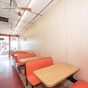 empty tables and orange chairs