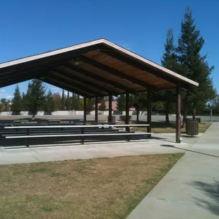 Covered area with picnic tables and barbecue grills