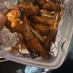 Dry buffalo wings with more grease than sauce.