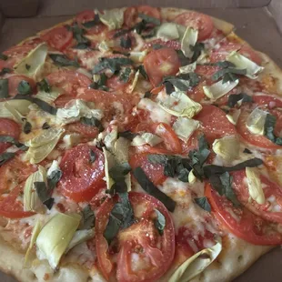 Neapolitan (medium) pizza with added artichoke hearts.