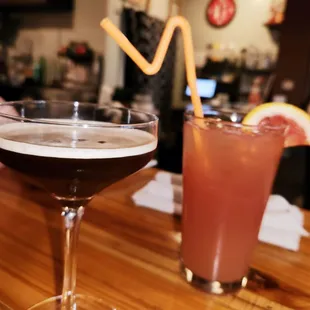 two cocktails on a bar
