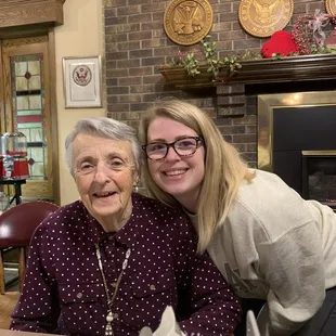 a woman and a woman sitting at a table