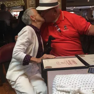 a man and woman kissing