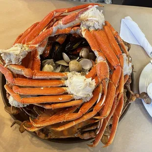 Platter for two, snow crab, blue crab, mussels, clams, shrimp, and two sides