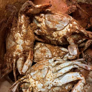 a pile of crabs in a paper bag