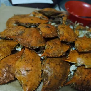 a pile of crabs on a cutting board